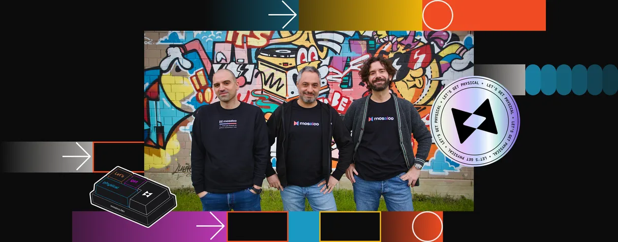 The Mosaico team standing together in front of a graffiti wall, wearing Mosaico branded shirts